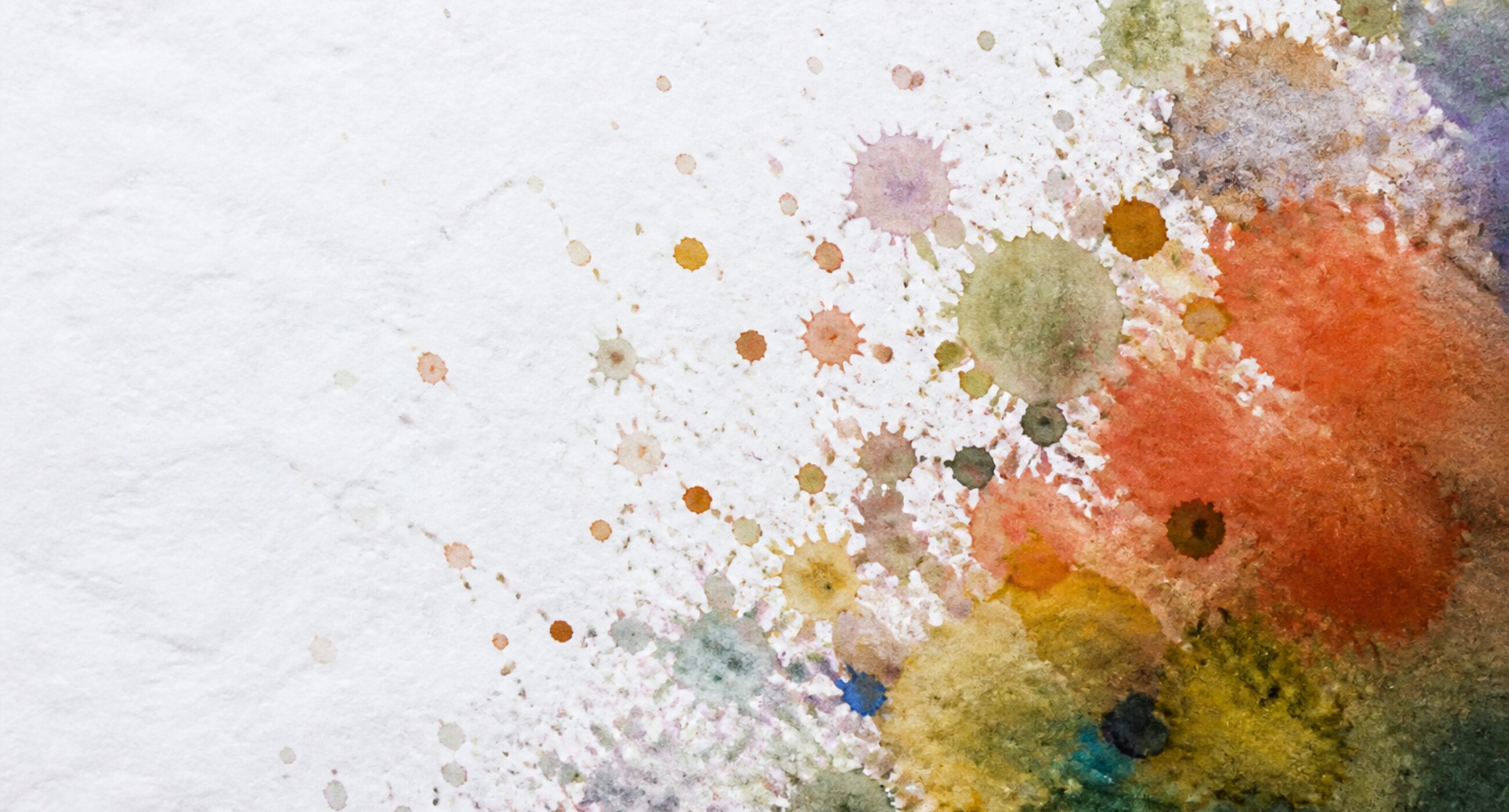 A wide horizontal ink wash dissolving into scattered droplets toward the right.